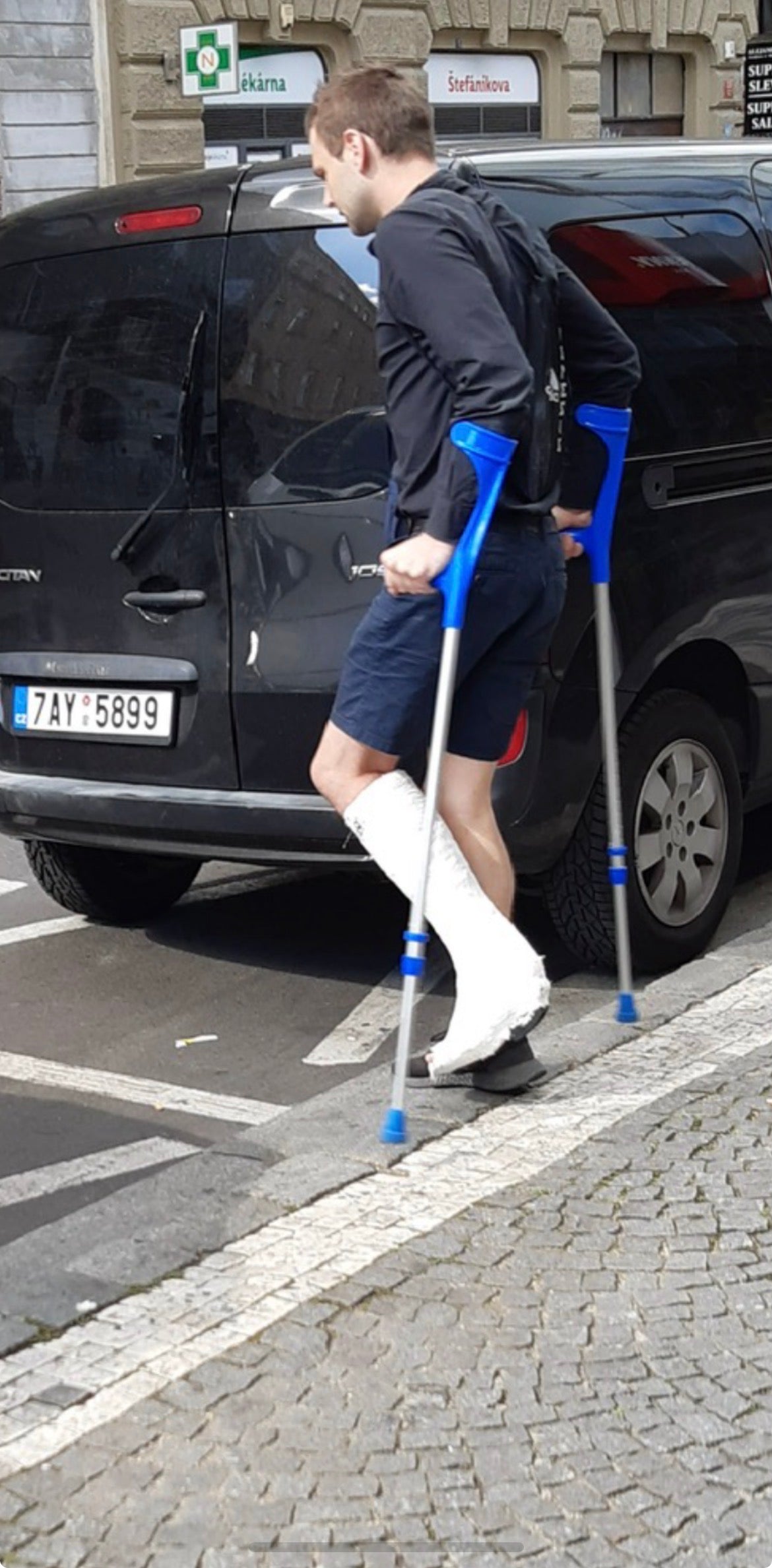 Young man in city center with slwc